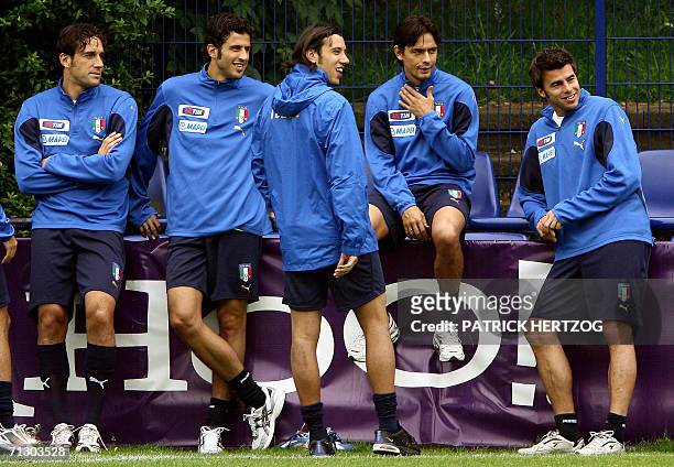 Italian players Luca Toni, Fabio Grosso, Cristian Zaccardo, Filippo Inzaghi and Andrea Barzagli joke before the start of a training session in...