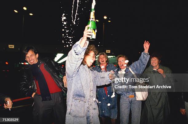 East Germans celebrate joyfully as they cross to freedom from East Berlin to the west through Checkpoint Charlie on the night of November 9th 1989...