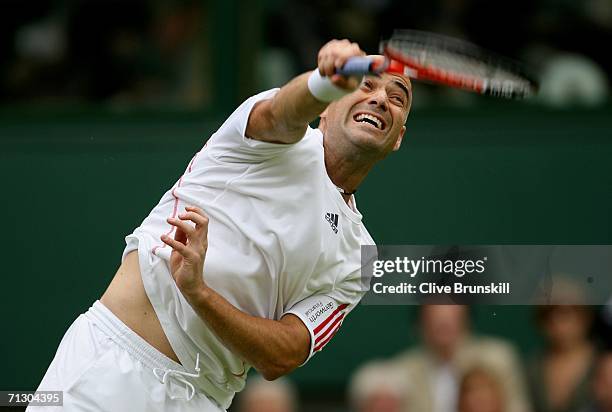 Andre Agassi of the United States serves against Boris Pashanski of Serbia and Montenegro during day two of the Wimbledon Lawn Tennis Championships...