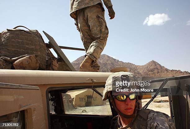 Army soldiers prepare for a military mission at an American base at Deh Afghan June 27, 2006 in the Zabul province of southern Afghanistan. The...