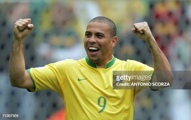 Brazilian forward Ronaldo celebrates after scoring his team's first goal during the round of 16 World Cup football match between Brazil and Ghana at...