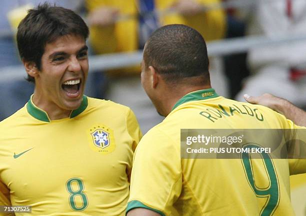 Brazilian forward Ronaldo celebrates with Brazilian midfielder Kaka after scoring his team's first goal during the round of 16 World Cup football...