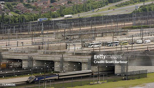 Vehicles approach the entrance of the Channel Tunnel on June 27, 2006 in Folkestone, England. The Channel Tunnel is a 50 km long rail tunnel beneath...