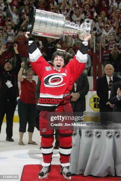 Rod Brind'Amour of the Carolina Hurricanes hoists the Stanley Cup after the Hurricanes defeated the Edmonton Oilers in game seven of the 2006 NHL...