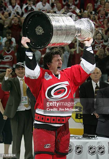 Rod Brind'Amour of the Carolina Hurricanes hoists the Stanley Cup after the Hurricanes defeated the Edmonton Oilers in game seven of the 2006 NHL...
