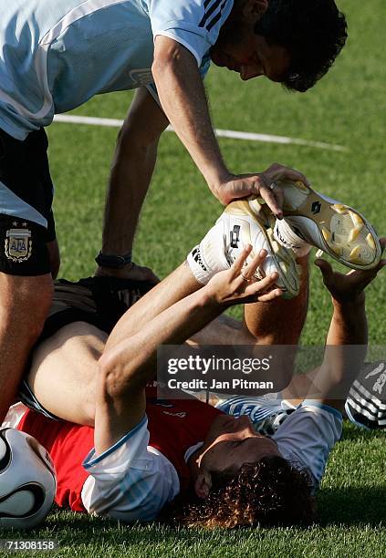 Fabricio Coloccini of Argentina stretches during a training session at the Adi-Dassler Sports Field on June 27, 2006 in Herzogenaurach, Germany....