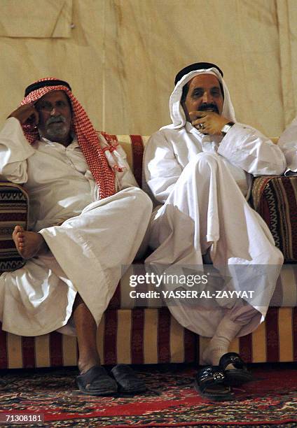 Kuwaiti men attend a parliamentary election rally in Al-Fardous, 20 km north of Kuwait City, 27 June 2006. The vigour of the campaign for this week's...