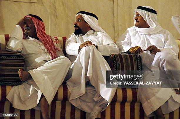 Kuwaiti men attend a parliamentary election rally in Al-Fardous, 20 km north of Kuwait City, 27 June 2006. The vigour of the campaign for this week's...
