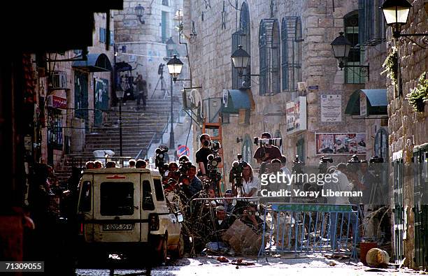 Photographers, cameramen and journalists from all over the world cover an operation of the Israeli army May 6, 2002 in Bethlehem, West Bank....