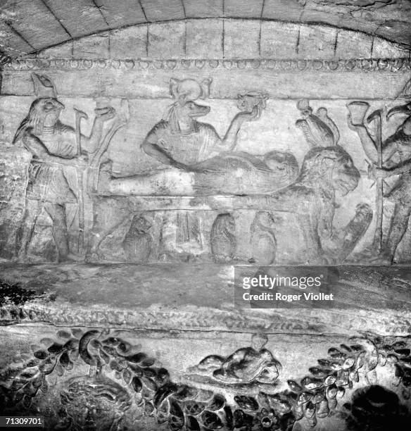 The Egyptian gods Horus and Anubis embalming Osiris, low relief of Ptol?maic era of the princes' death chamber, in the catacombs of Alexandria . On...
