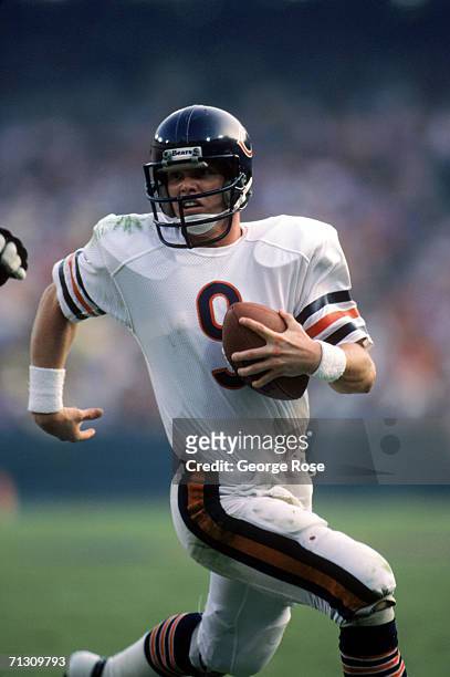 Quarterback Jim McMahon of the Chicago Bears runs with the ball during a game against the Los Angeles Rams at Anaheim Stadium on November 6, 1983 in...