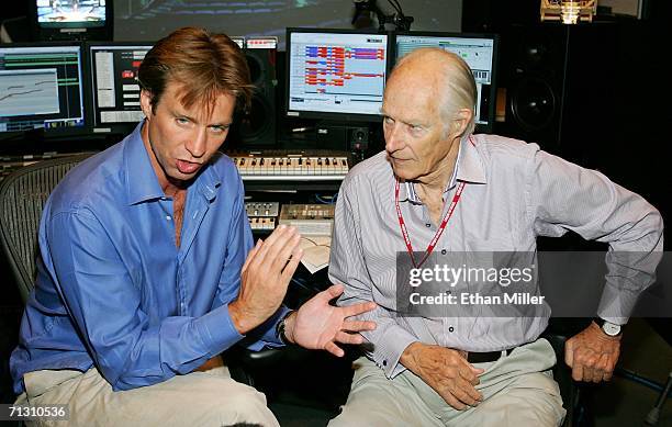 Musical directors Giles Martin and his father Sir George Martin speak during a behind-the-scenes tour of "The Beatles LOVE by Cirque du Soleil" at...