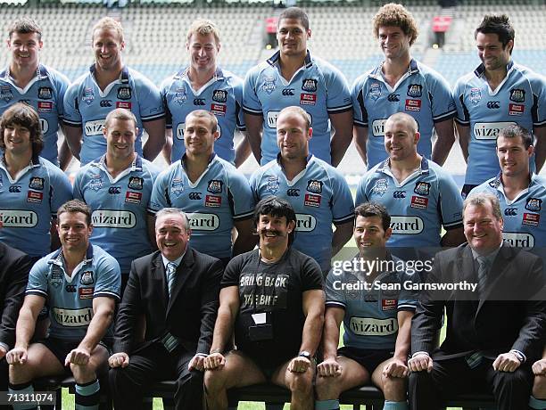 Personality Matthew Johns , as his alter ego Reg Reagan, poses with the NRL New South Wales Blues team during the team photo session at the Telstra...