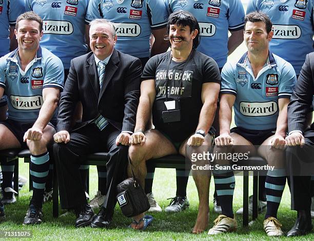 Personality Matthew Johns , as his alter ego Reg Reagan, poses with the NRL New South Wales Blues team during the team photo session at the Telstra...