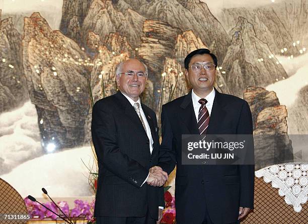 Australian Prime Minister John Howard is greeted by Zhang Dejiang the Communist Party Secretary of Guangdong province ahead of their meeting in...