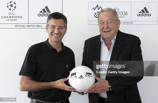 Herbert Hainer, CEO and Chairman of the adidas Group and Lennart Johannson, FIFA Vice-President sign an adidas football on June 28, 2006 at adidas...