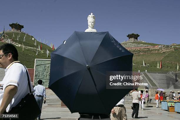 Tourists visit the Riyue Mountain on June 27, 2006 in Xining of Qinghai Province, China. The Qinghai-Tibet Railway, which will begin trial operations...