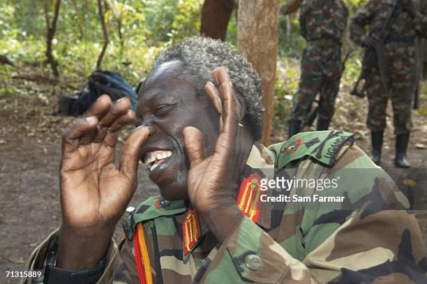 Senior commander of the Ugandan rebel group the Lord's Resistance Army, Vincent Otti laughs during a rare appearance in front of journalists in this...