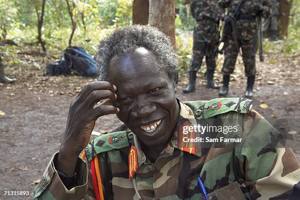 Senior commander of the Ugandan rebel group the Lord's Resistance Army, Vincent Otti laughs during a rare appearance in front of journalists in this...