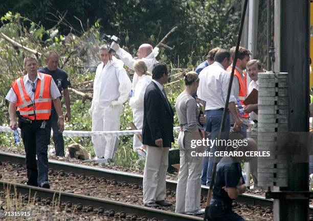 Members of the Federal Police and forensic experts search the site where the bodies of two missing school girls, Stacy Lemmens and Nathalie Mahy were...