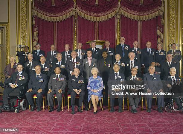 Queen Elizabeth ll joins members of the Victoria Cross and George Cross Association for a photograph during a lunchtime reception at Windsor Castle...
