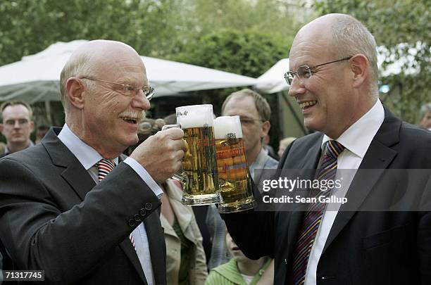 Social Democrats Bundestag faction head Peter Struck and Christian Democrat Volker Kauder sip beer at the SPD summer party June 28, 2006 in Berlin,...