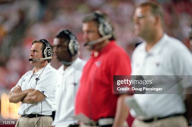 Head Coach Bill Belichick of the New England Patriots watches the action from the sidelines during the game against the Washington Redskins at the...