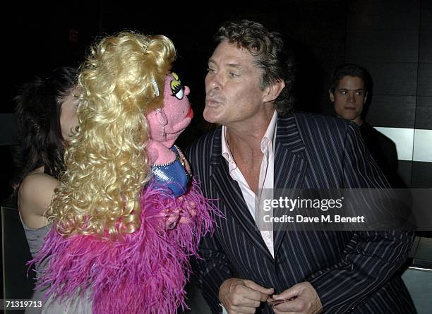 Actor David Hasselhoff looks for a kiss from puppet Lucy The Slut at the after party following the UK Premiere of the new play "Avenue Q" at Mint...