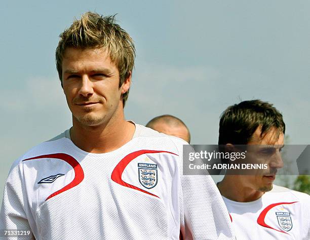 English midfielder David Beckham and defender Gary Neville arrive at the team training camp at Mittelbergstadion in Buhlertal, 29 June 2006. England...