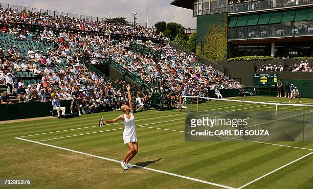 United Kingdom: Maria Sharapova of Russia serves against US Ashley Harkleroad on the 2nd round of the Wimbledon Tennis Championships in Wimbledon, in...