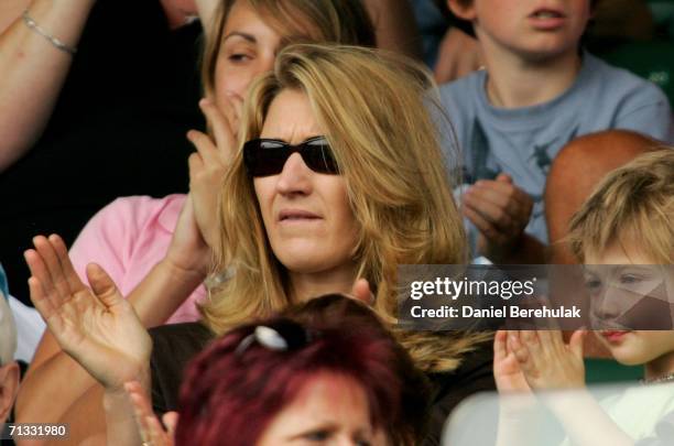 Steffi Graf wife of Andre Agassi and their son Jaden Gil watch Andre Agassi of The United States and Andreas Seppi of Italy on Centre Court during...