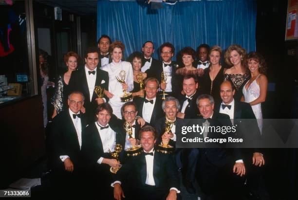 The cast of TV's "L.A. Law" pose for a group photo after winning an Emmy Award for "Best Drama" at the 1989 Emmy Award ceremonies in Pasadena,...