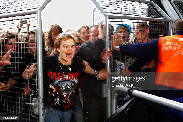 Guns'n Roses fan rushes through the gates at the opening of the Roskilde Festival 29 June 2006 some 30 km west of Copenhagen. Some 70,000 rock fans...