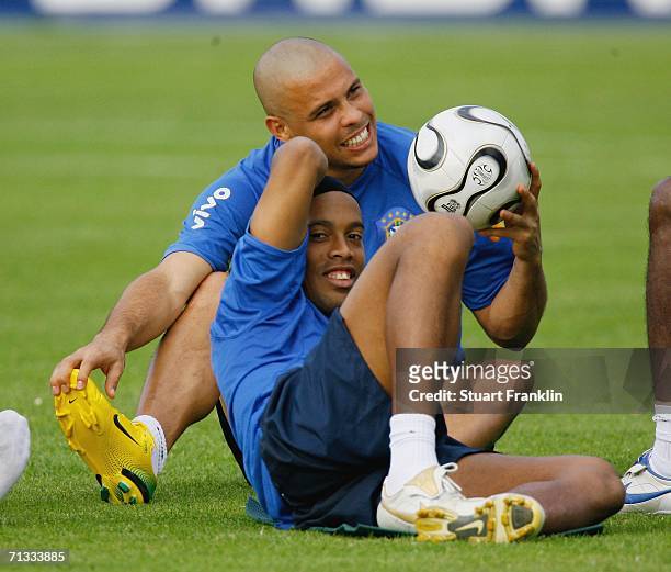 Ronaldo relaxes with Ronaldinho of Brazil during the Brazil National Football Team training session for the FIFA World Cup Germany 2006 at the...