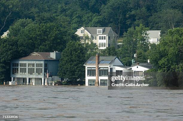 Floodwaters from the Delaware River reach homes and businessses on the banks June 29, 2006 in New Hope, Pennslyvania as seen from Lambertville, New...