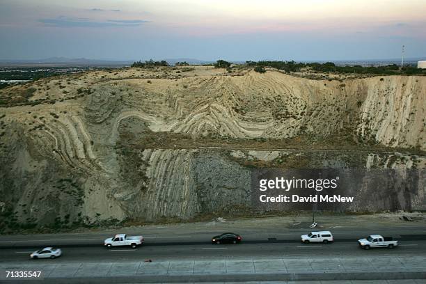 Layers of earthquake-twisted ground are seen at dusk where the 14 freeway crosses the San Andreas Fault on June 28, 2006 near Palmdale, California....