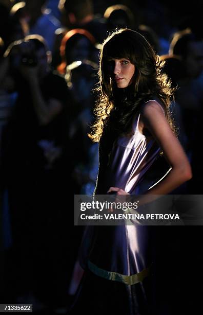 Model presents a gown by Bulgarian designer and pop singer Irina Florin during her first fashion show in Sofia, 29 June 2006. AFP PHOTO / VALENTINA...