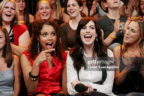 Actress Anne Hathaway sits with VJ Susie Castillo and her cousin Meredith Shevory during an appearance on MTV's Total Request Live at MTV Studios...