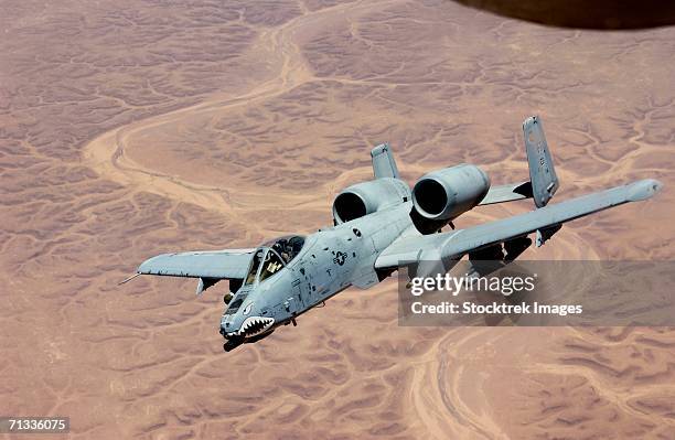 an a-10 thunderbolt from the 407th expeditionary fighter squadron tallil air base, soars above the skies of iraq after receiving fuel from a kc-135, june 19, 2003. - warthog stock pictures, royalty-free photos & images