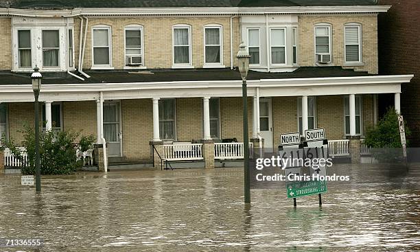 Downtown buildings and signs are submerged under a cresting Delaware River June 29, 2006 in Easton, Pennsylvania. Gov. Jon S. Corzine of New Jersey...