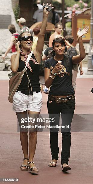 Elen Rivas, girlfriend of Frank Lampard and Michaela Henderson-Thyne, girlfriend of Stewart Downing wave at friends at the Europa theme park on June...