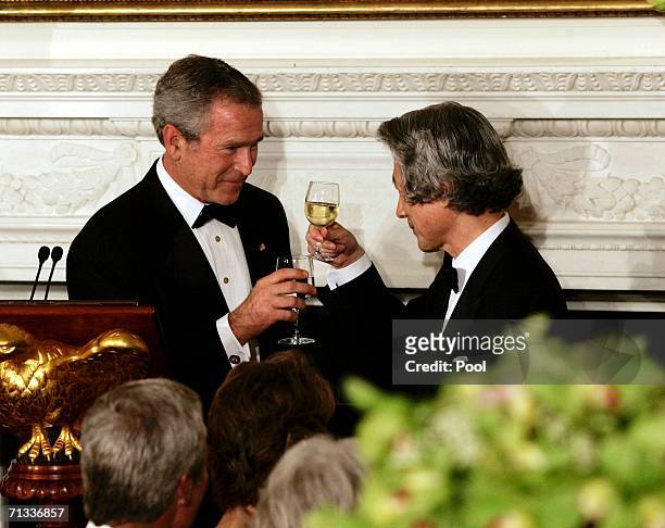 Japanese Prime Minister Junichiro Koizumi and U.S. President George W. Bush make a toast before a state dinner at the White House June 29, 2006 in...