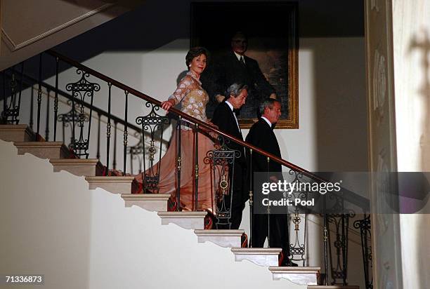 First lady Laura Bush, Japanese Prime Minister Junichiro Koizumi and U.S. President George W. Bush enter the Grand Foyer for a photo opportunity at...