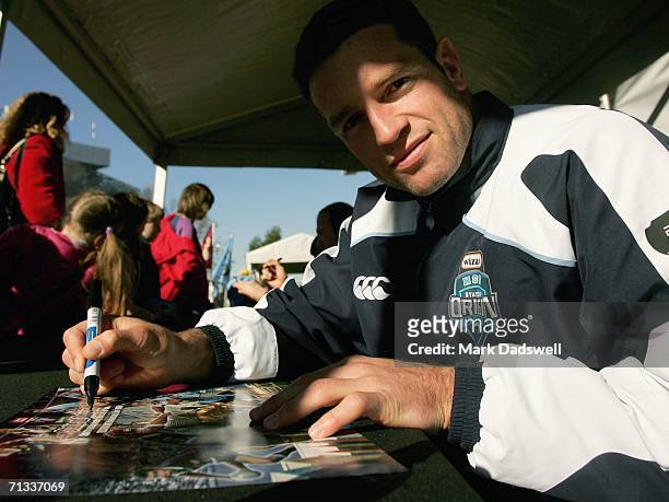 Danny Buderus captain of the NSW Blues signs autographs for fans during the State of Origin player appearance at Federation Square on June 30, 2006...