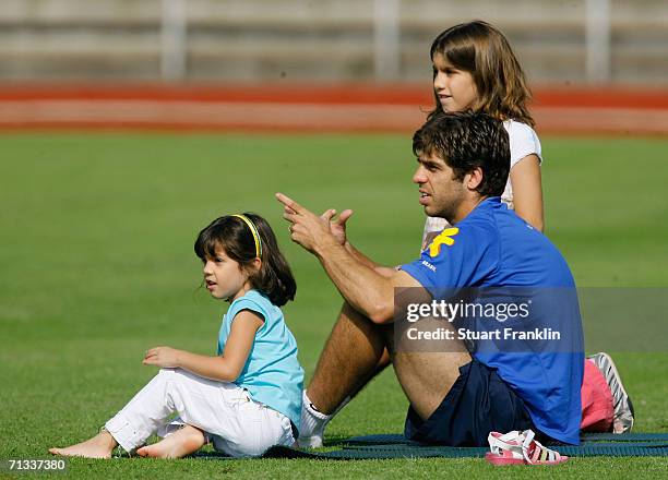 Juninho Pernambucano of Brazil and his daughters during the Brazil National Football Team training session for the FIFA World Cup Germany 2006 at the...