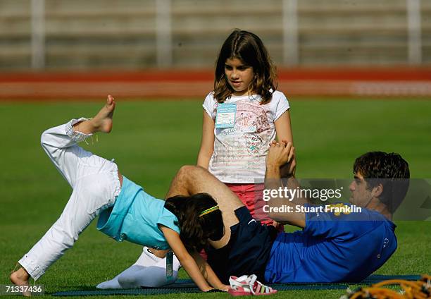 Juninho Pernambucano of Brazil and his daughters during the Brazil National Football Team training session for the FIFA World Cup Germany 2006 at the...