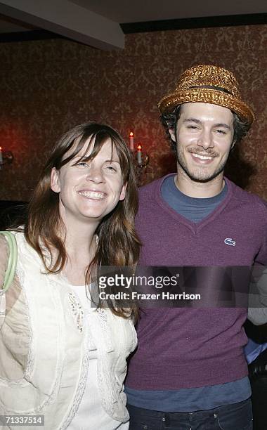 Warner Independent Pictures president Polly Cohen poses with actor Adam Brody pose at the Los Angeles premiere after party of "A Scanner Darkly"...