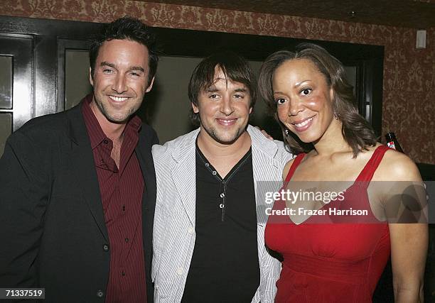 Actor Dameon Clarke, director Richard Linklater and Actress Angela Rawna pose at the Los Angeles premiere after party of "A Scanner Darkly" during...