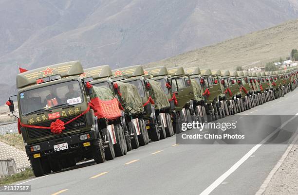 Military trucks run along the Qinghai-Tibet Railway on June 25, 2006 in Duilongdeqing County of Tibet Autonomous Region, China. The Qinghai-Tibet...