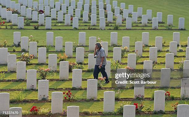 Man walks among the graves of unknown soldiers killed in the Battle of Somme at the Thiepval Memorial and Anglo-French cemetery as the 90th...